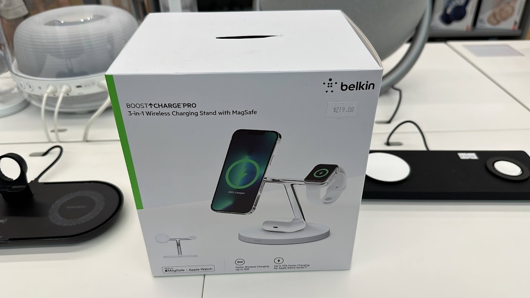 A white product box for a Belkin wireless charger is displayed on a table.