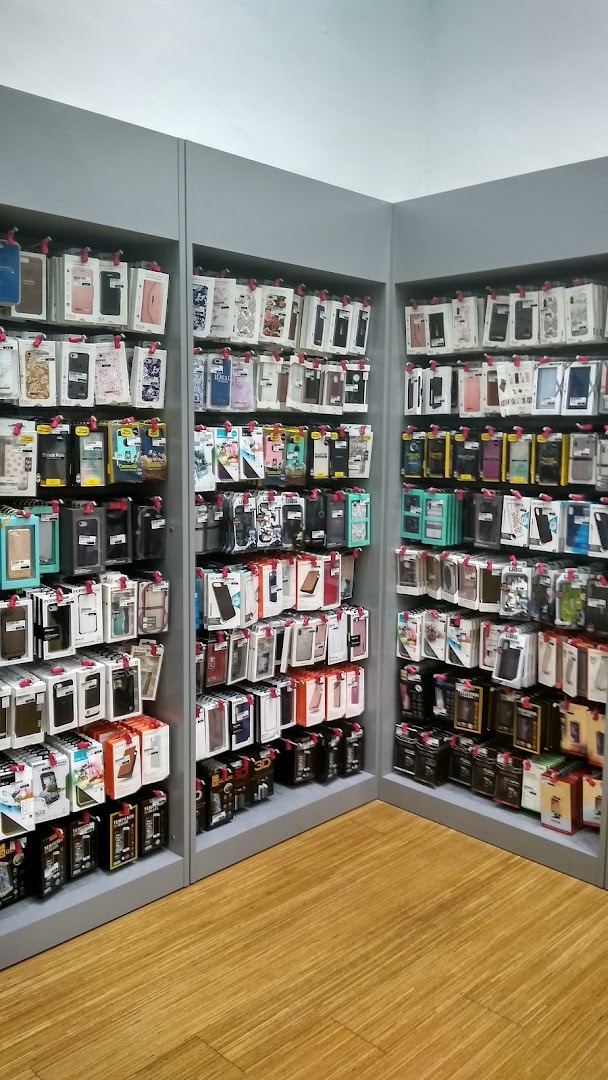 Interior view of a shop displaying many phone cases and accessories on shelves.