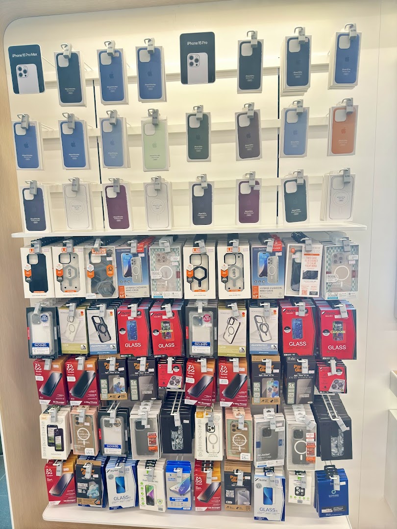 A retail display wall showcasing various iPhone cases and accessories.