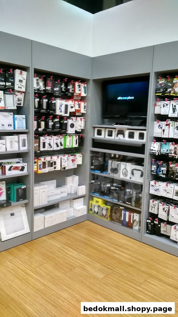 Interior view of a retail shop displaying electronic accessories and products on shelves.