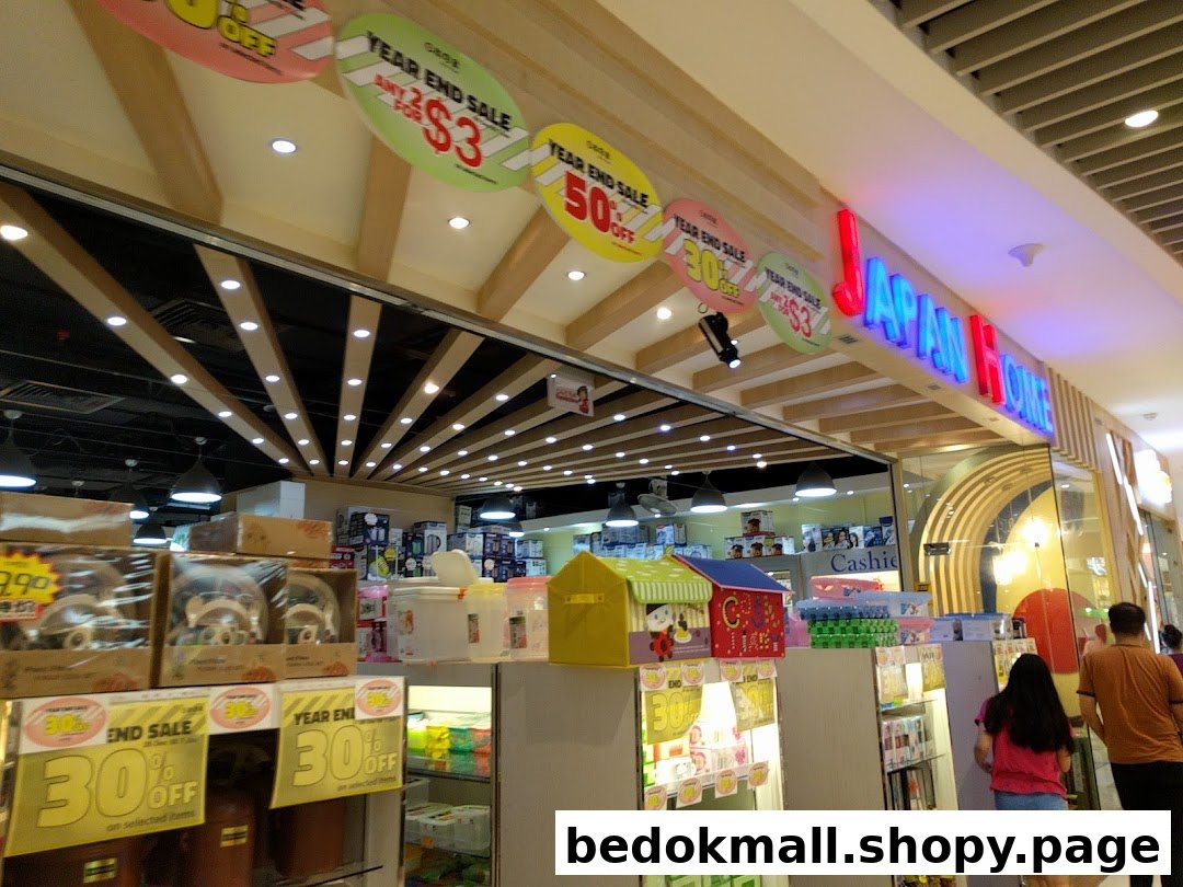 Entrance of Japan Home shop with sale signs and products visible.