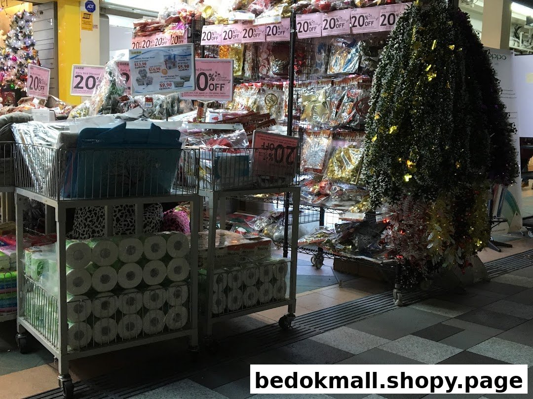 Interior view of a retail shop with products on display and discount signs.