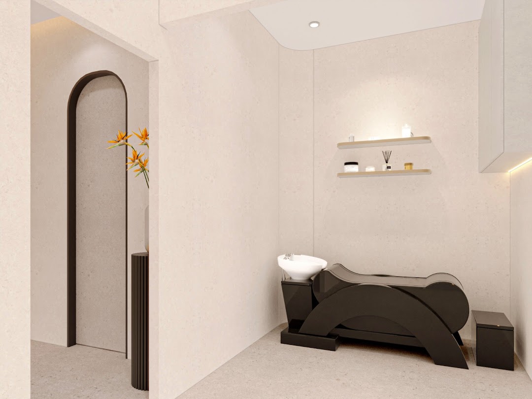 Interior of a hair salon with a black washing station and shelves.