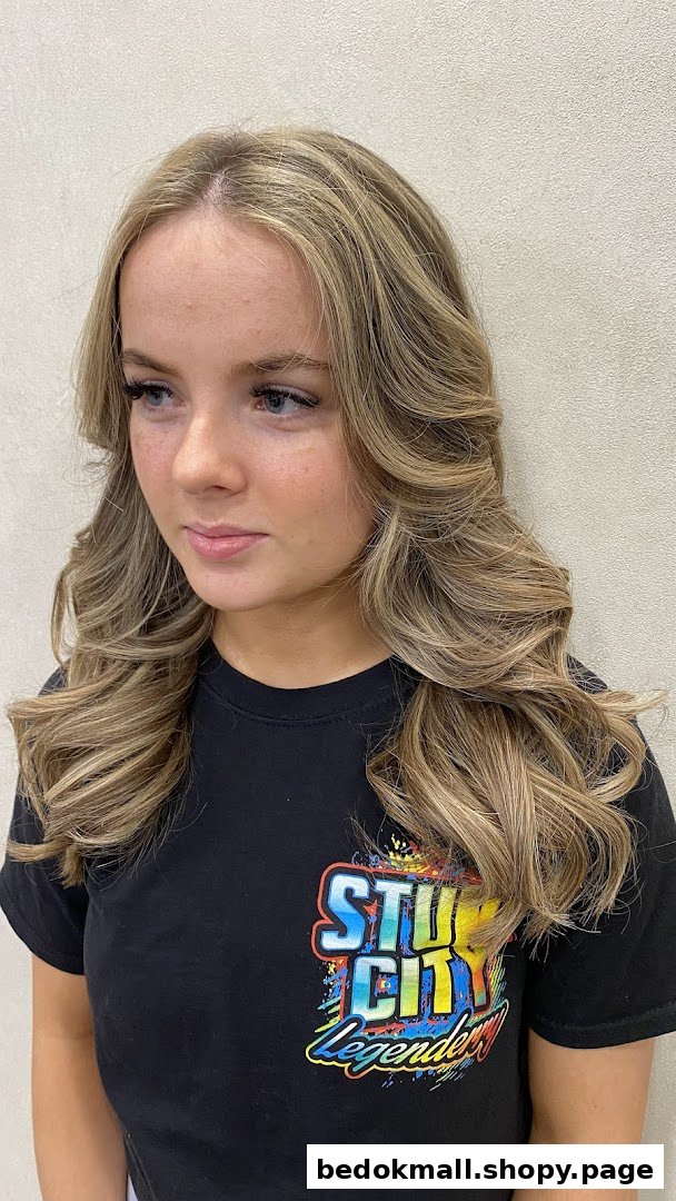 Close-up of a young woman with freshly styled blonde hair.