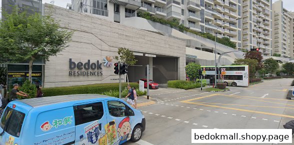 Street view of Bedok Residences building with a convenience store and vehicles.