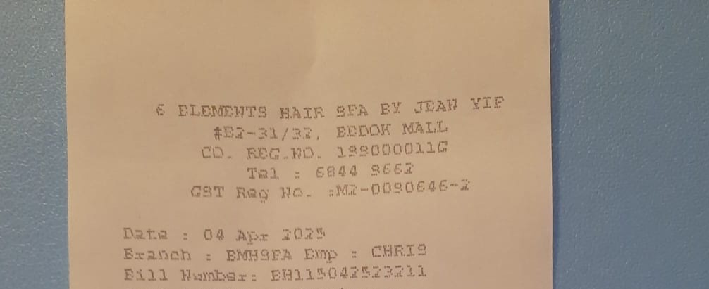 A printed document showing business details, contact information, and a date.