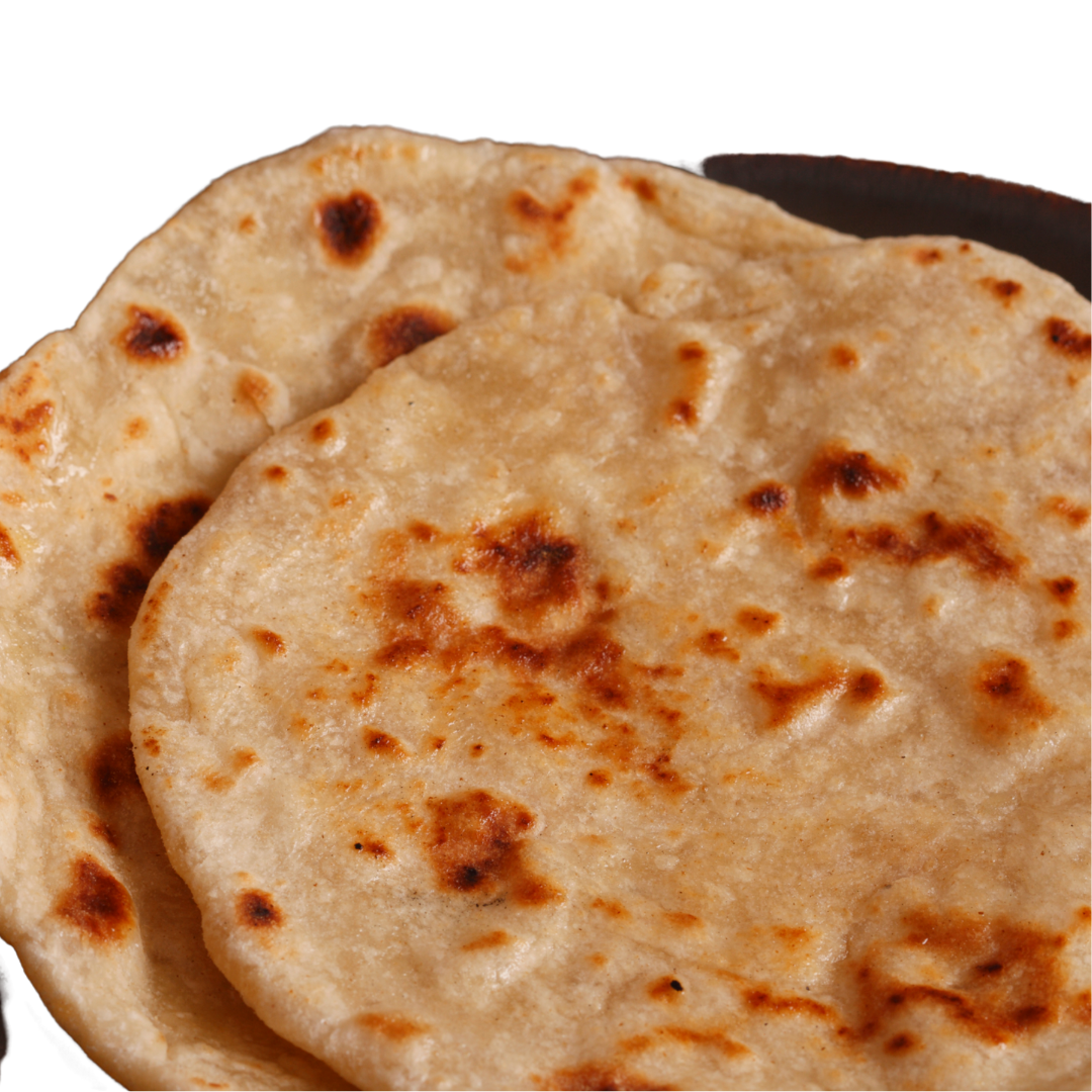 Two golden-brown flatbreads, possibly rotis, on a dark surface.