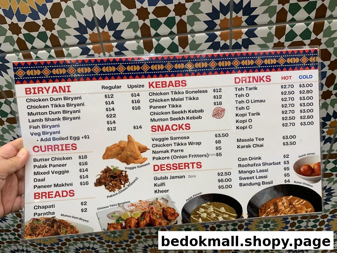 Close-up of a food and drink menu with prices and item categories.