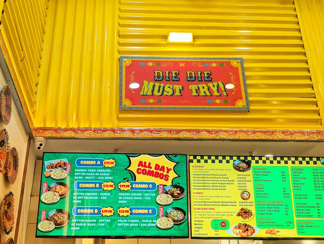 Digital menu board displaying food combos, curries, drinks, and prices.