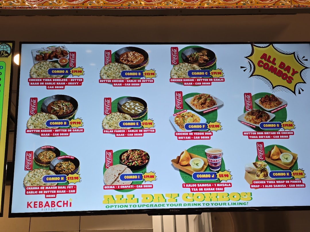 Digital menu board displaying various food combos with images and prices.