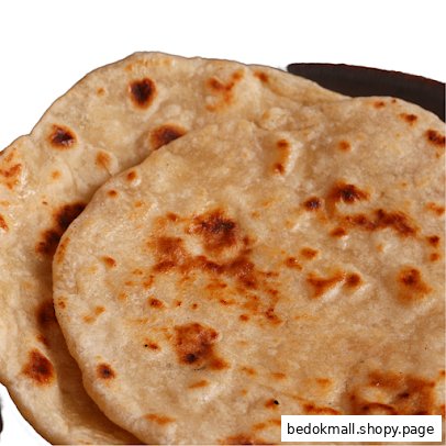 Close-up of two golden-brown flatbreads with toasted spots.