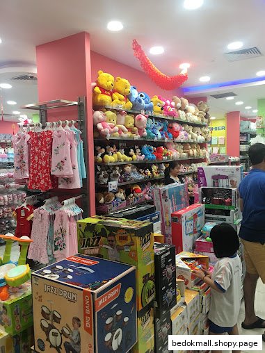 Shop interior displaying children's toys, clothing, and customers browsing.