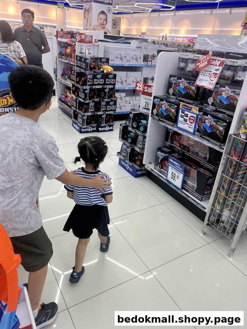 People browsing toys on shelves in a brightly lit store.