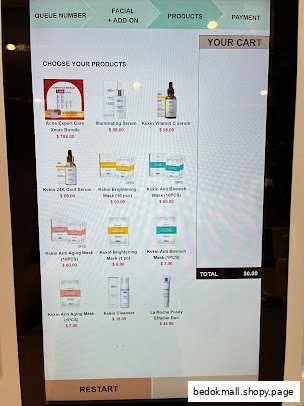 Digital screen displaying skincare products for selection with prices.