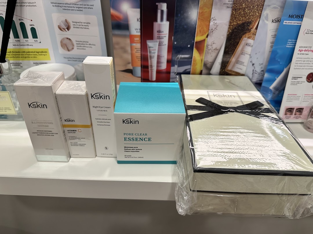 Kskin skincare products displayed on a shelf with promotional materials.