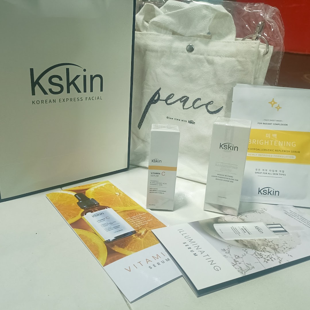 Kskin skincare products, branded bag, and promotional leaflets displayed on a surface.