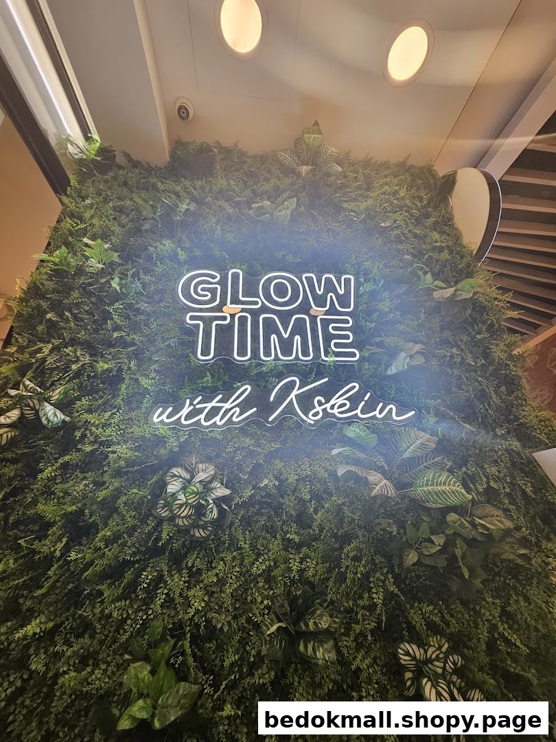 Green wall with a glowing neon sign 'GLOW TIME with Kskin'.