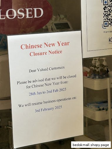 Shop front with a Chinese New Year closure notice.