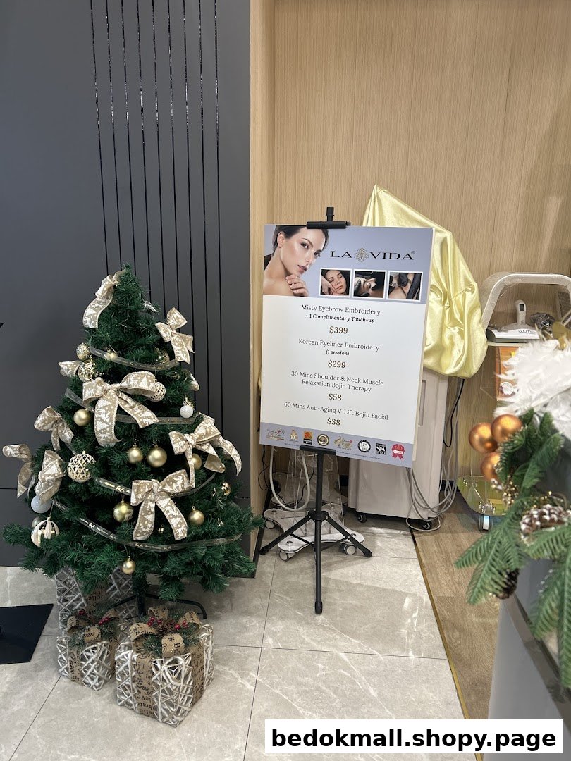 Christmas tree and service menu inside a shop.