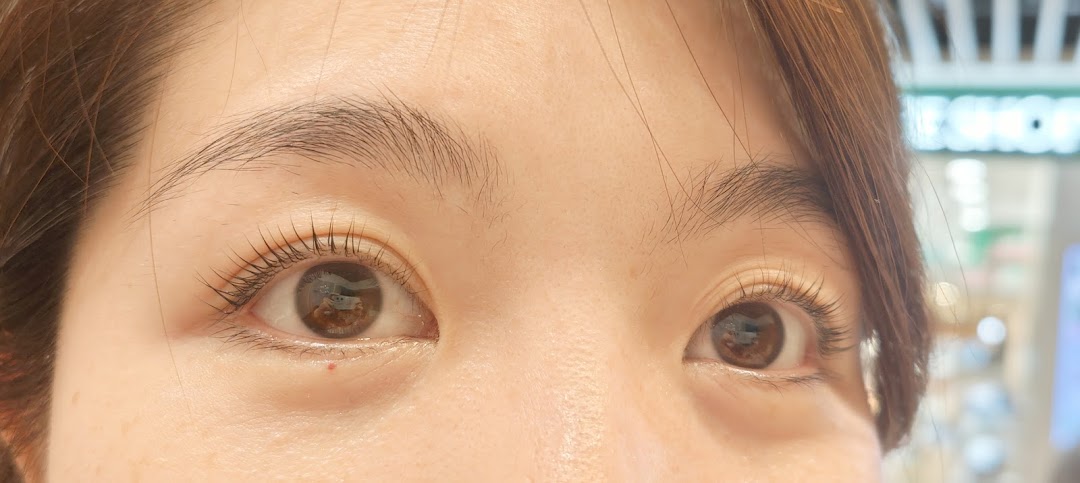 Close-up of a person's eyes showing treated eyelashes.