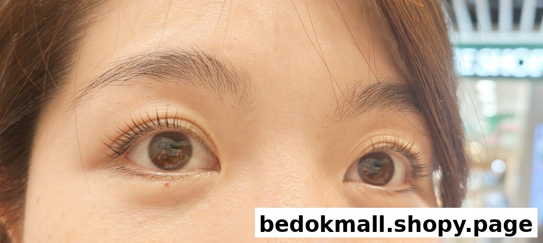 Close-up of a person's eyes showing treated eyelashes.
