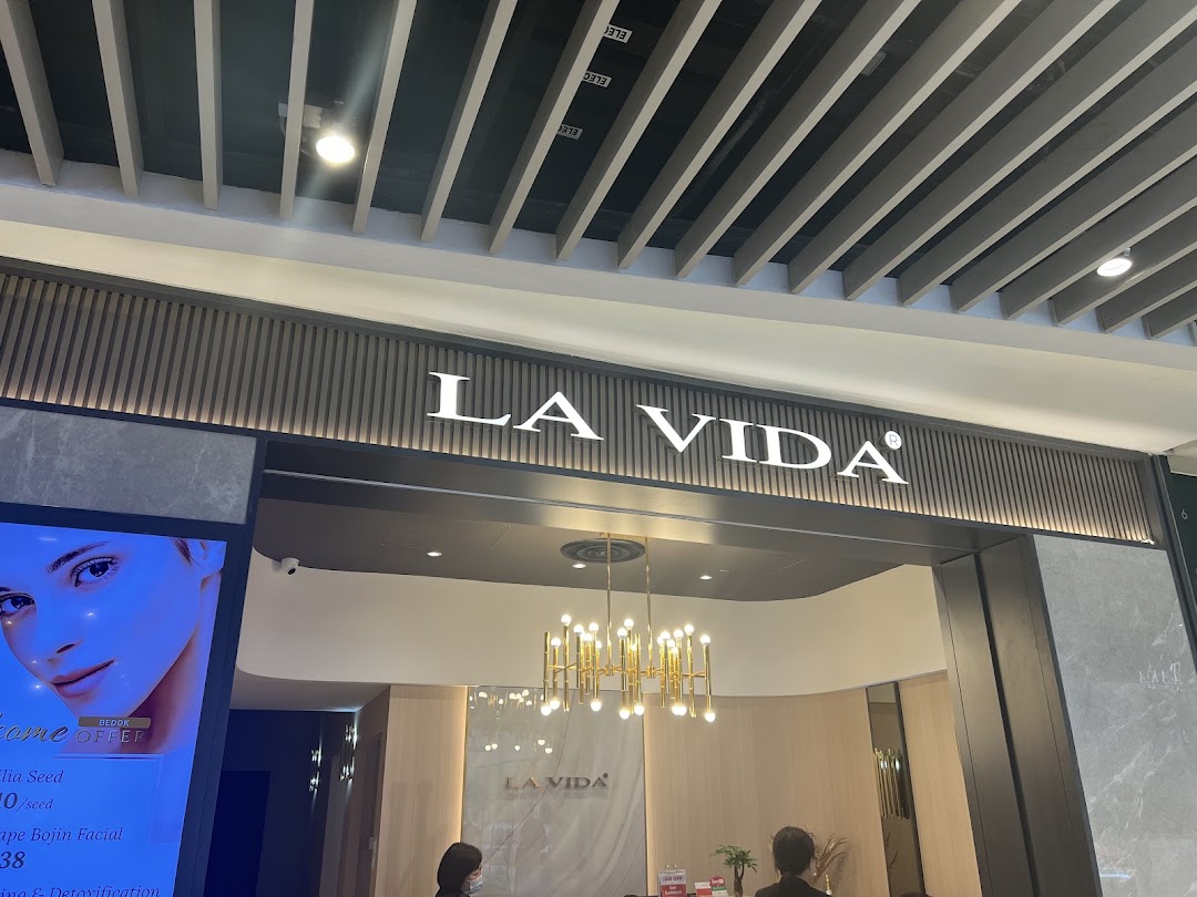 Shop entrance with 'LA VIDA' signage and partial interior view.
