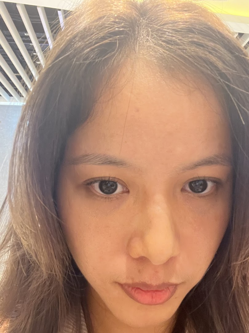 Close-up of a person's face looking directly at the camera.