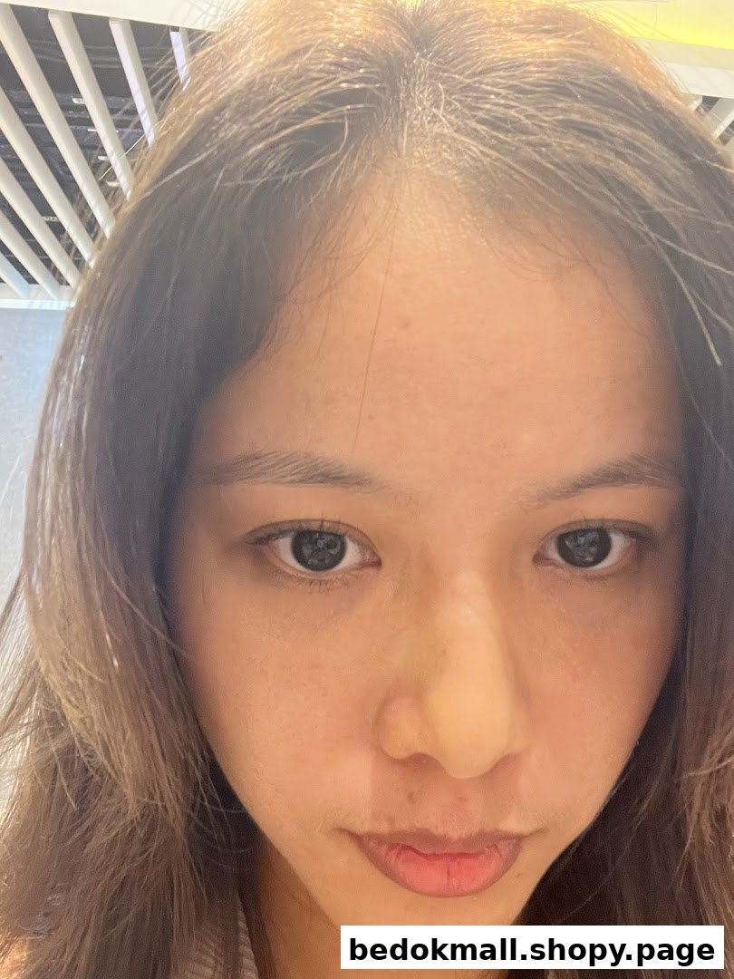 Close-up of a person's face looking directly at the camera.