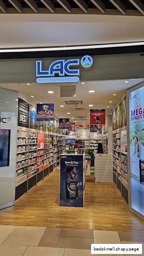 View of the LAC Nutrition For Life shop entrance with products visible inside.