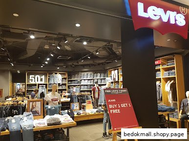 Interior view of a Levi's store with clothing displays and mannequins.