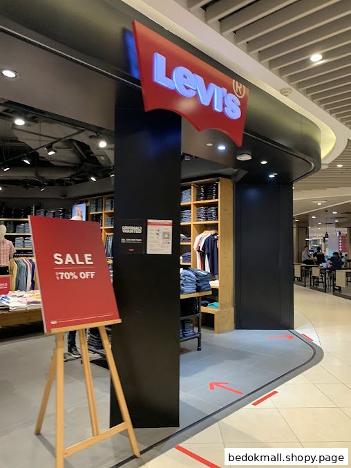 Levi's store entrance with a prominent logo and a 70% off sale sign.
