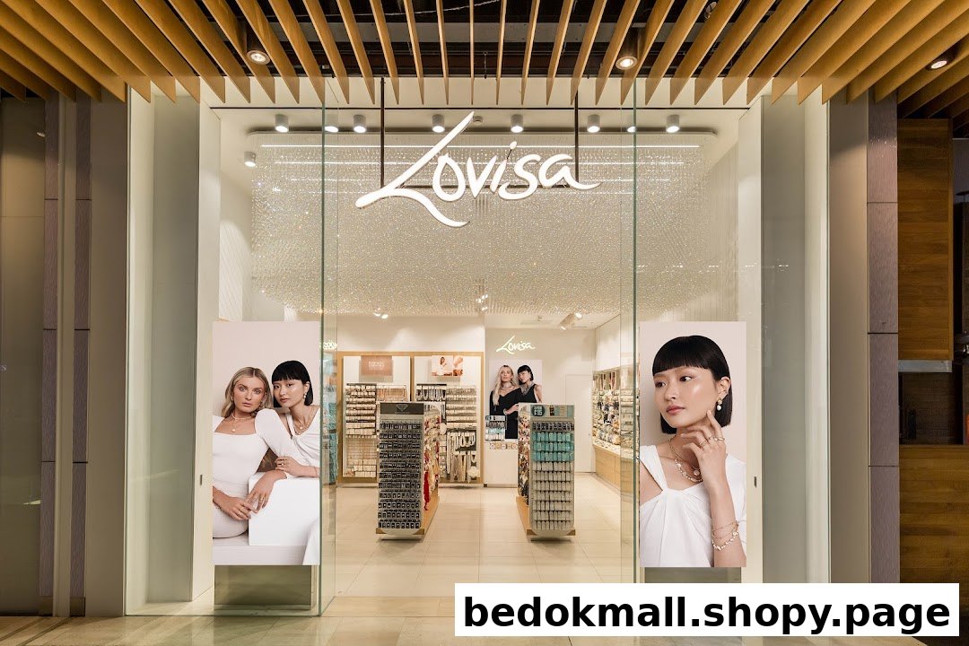 The front entrance of a Lovisa jewelry store with glass doors and window displays.