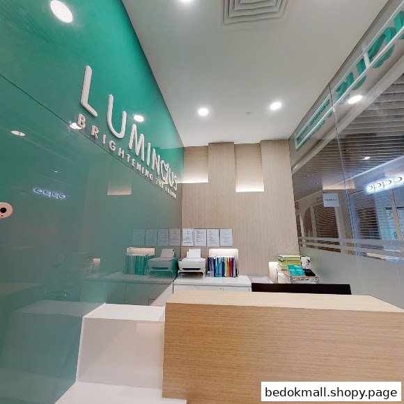 Interior view of a dental clinic reception area with a counter and clinic name.