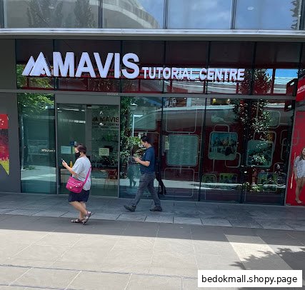 Exterior view of Mavis Tutorial Centre with people walking by.
