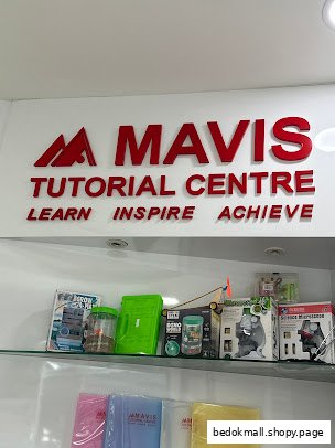 Shop interior showing Mavis Tutorial Centre sign and merchandise on shelves.