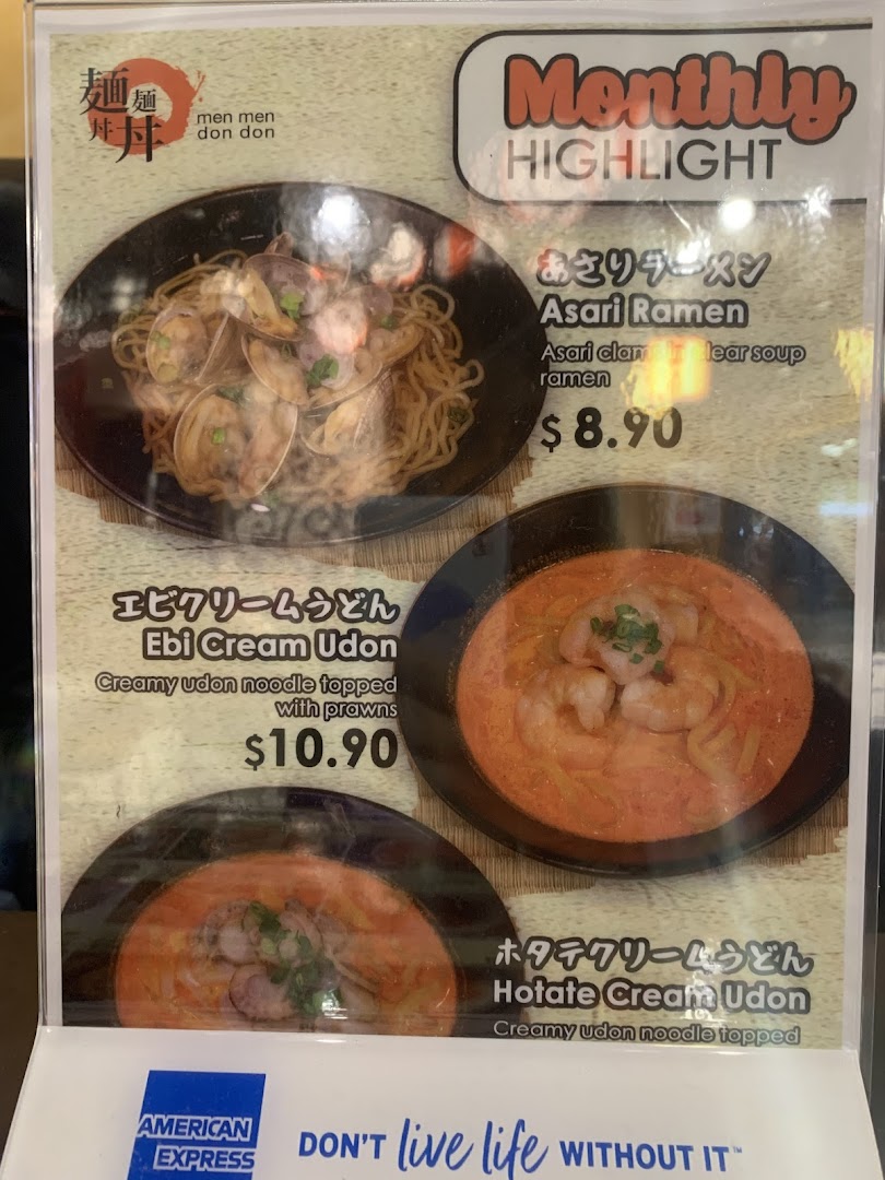 Menu board displaying ramen and udon dishes with prices.
