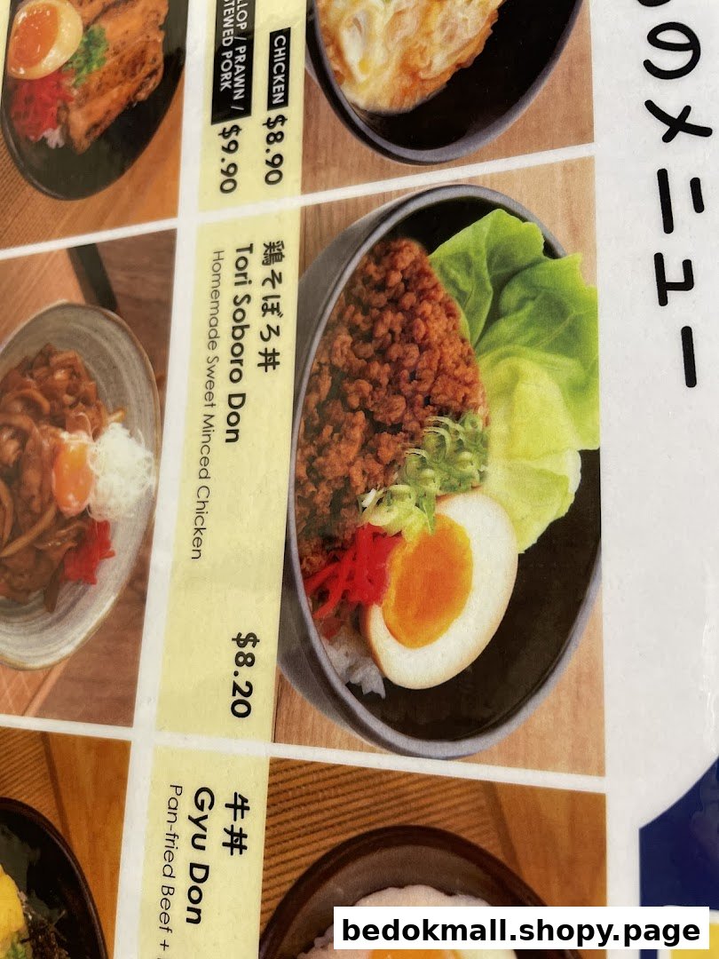 Close-up of a food menu displaying various Japanese dishes and prices.