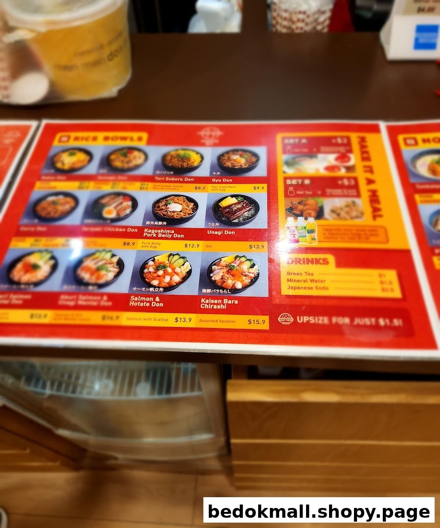 Menu board showing rice bowls, sets, drinks, and prices.