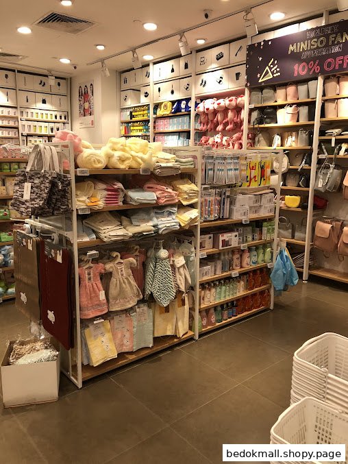Interior view of a MINISO store with various products on display.