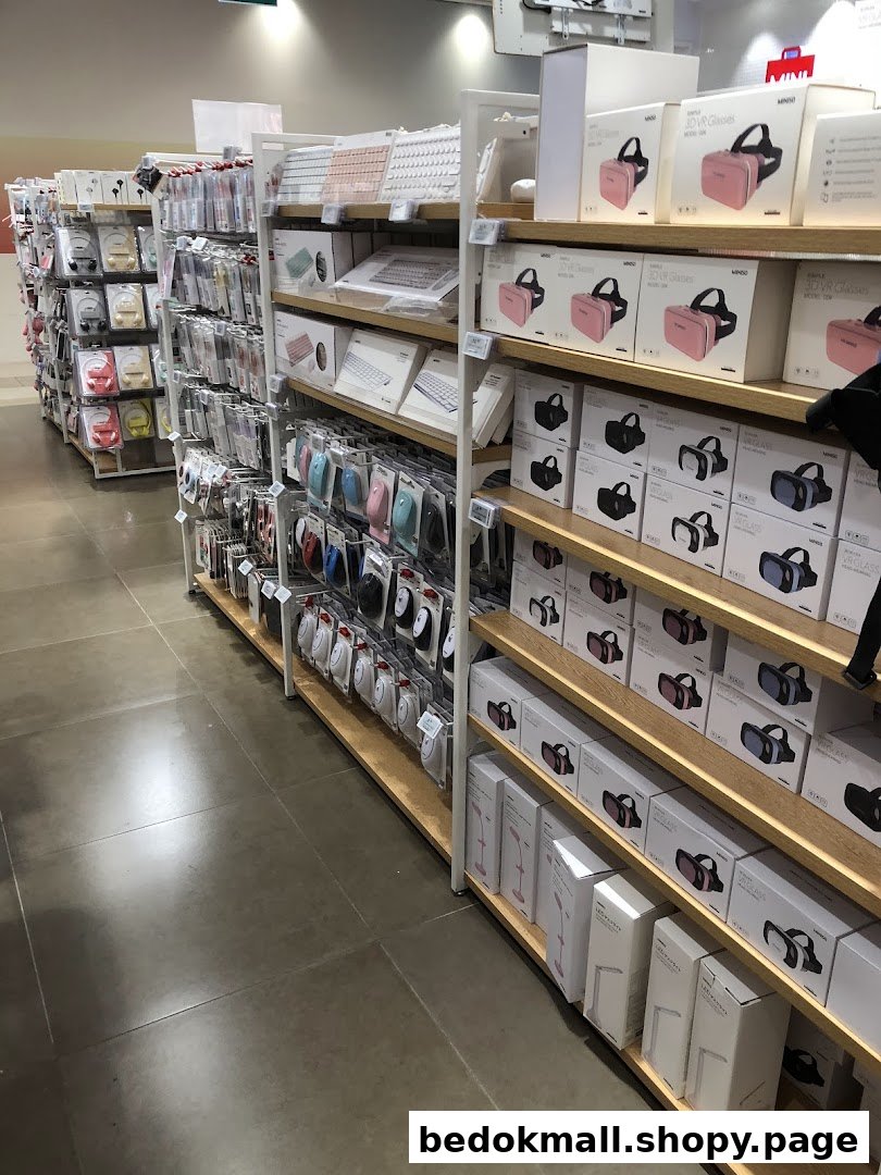 Interior view of a retail shop with shelves full of electronic products and accessories.