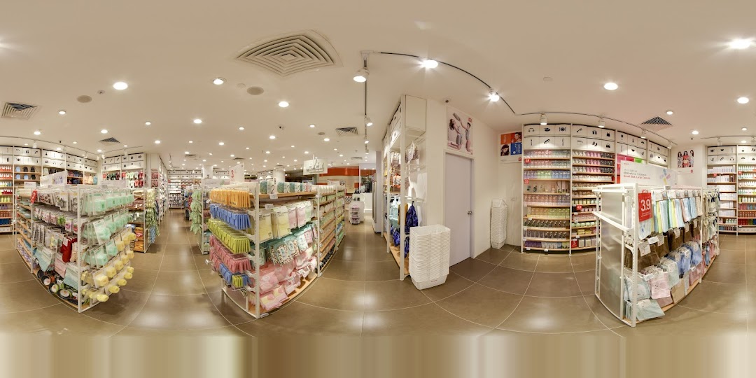 Interior view of a MINISO store with aisles of various products.