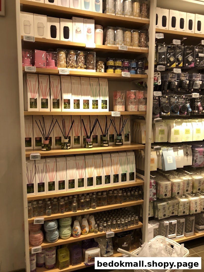 Shelves filled with diffusers, candles, and various household products inside a retail shop.
