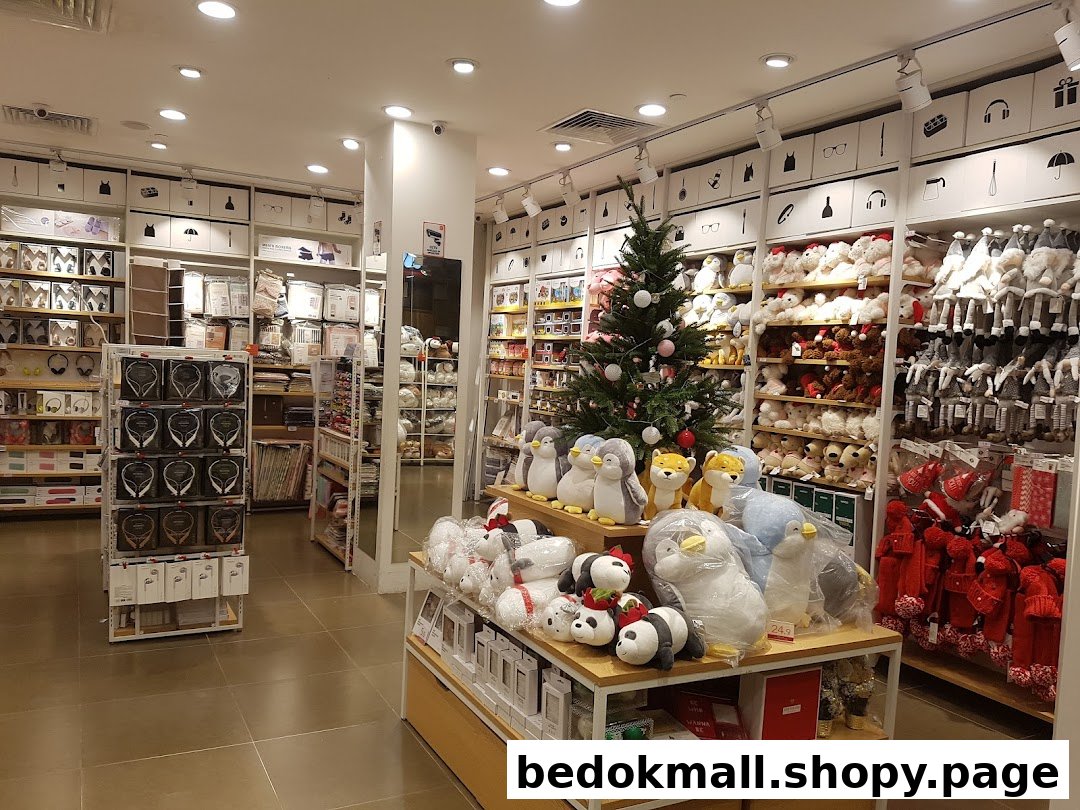 Interior view of a MINISO store with products, plush toys, and a Christmas tree.