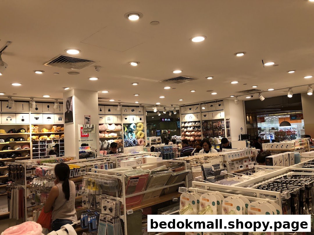 Interior view of a retail shop with products on shelves and customers browsing.