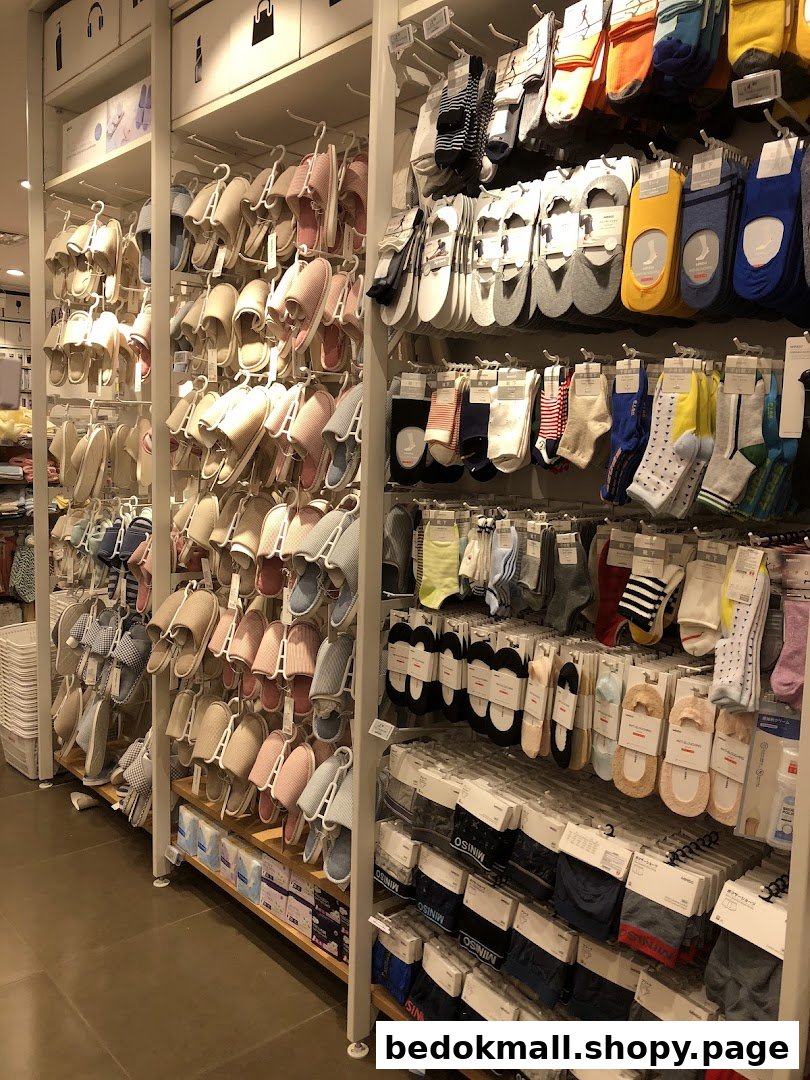 Interior view of a retail shop displaying slippers and socks on shelves.