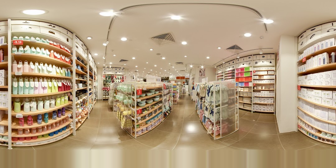 Interior view of a retail store with aisles of various products on shelves.