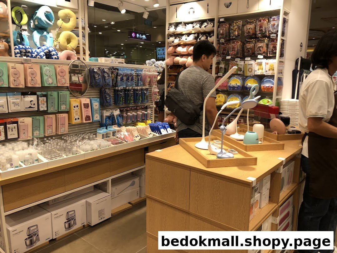 Interior view of a MINISO store with products on shelves and customers browsing.