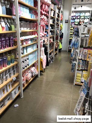 Interior view of a retail shop with shelves full of various products.