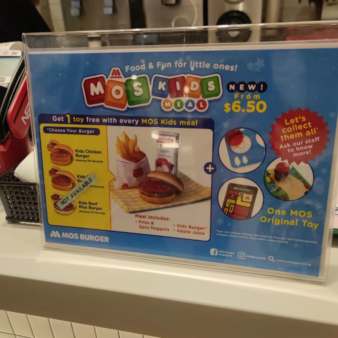 A promotional display for a MOS Kids Meal showing food items and a toy.