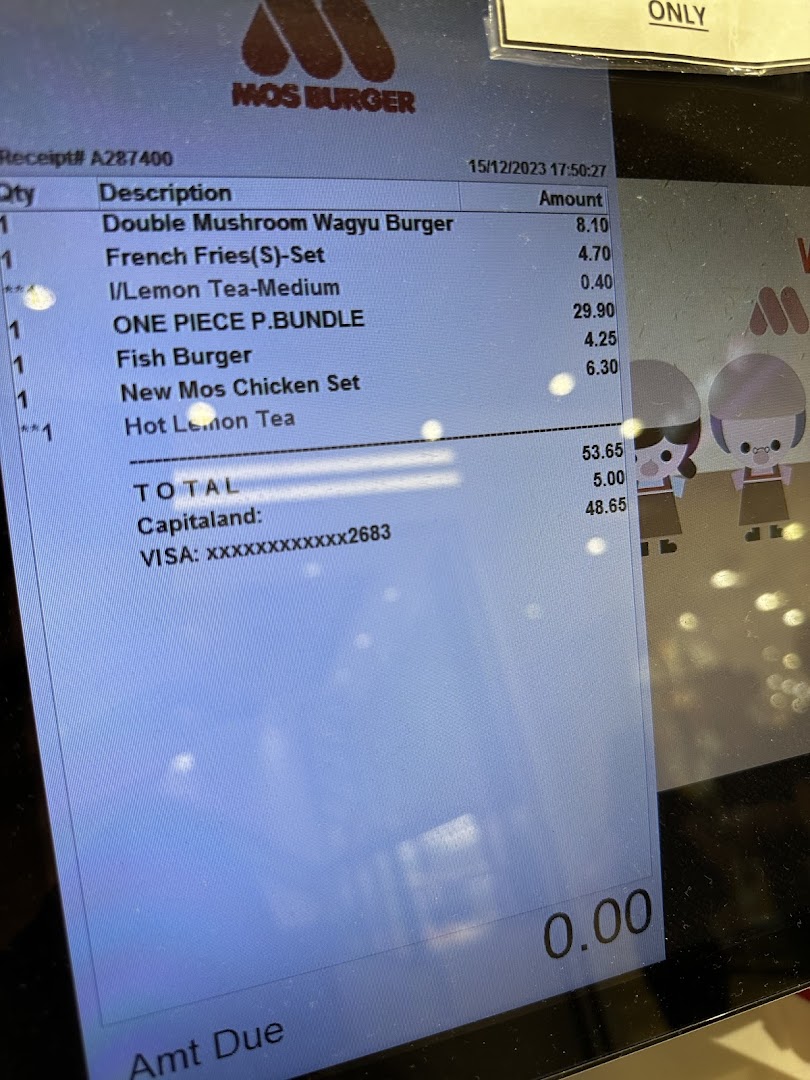 Digital screen displaying a Mos Burger order receipt with items and total.